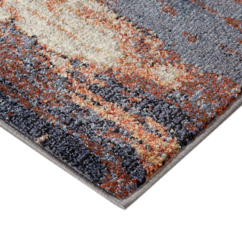 8′ X 10′ Beige Rust and Blue Abstract Power Loom Area Rug