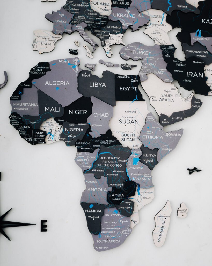 24″ X 39″ Black Gray and White Wood World Map Hanging Dimensional Sculpture