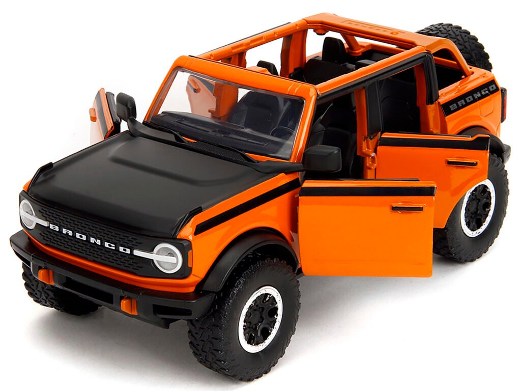 2021 Ford Bronco Open-Top Orange with Black Stripes and Hood with Extra Wheels “Just Trucks” Series 1/24 Diecast Model Car by Jada