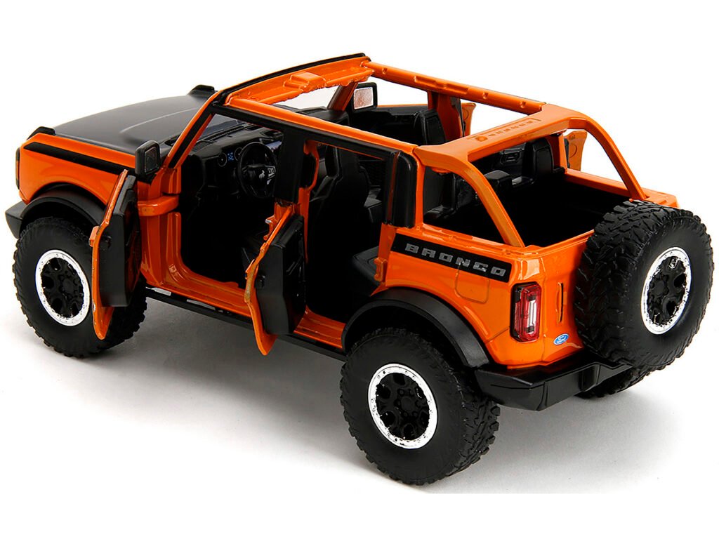 2021 Ford Bronco Open-Top Orange with Black Stripes and Hood with Extra Wheels “Just Trucks” Series 1/24 Diecast Model Car by Jada
