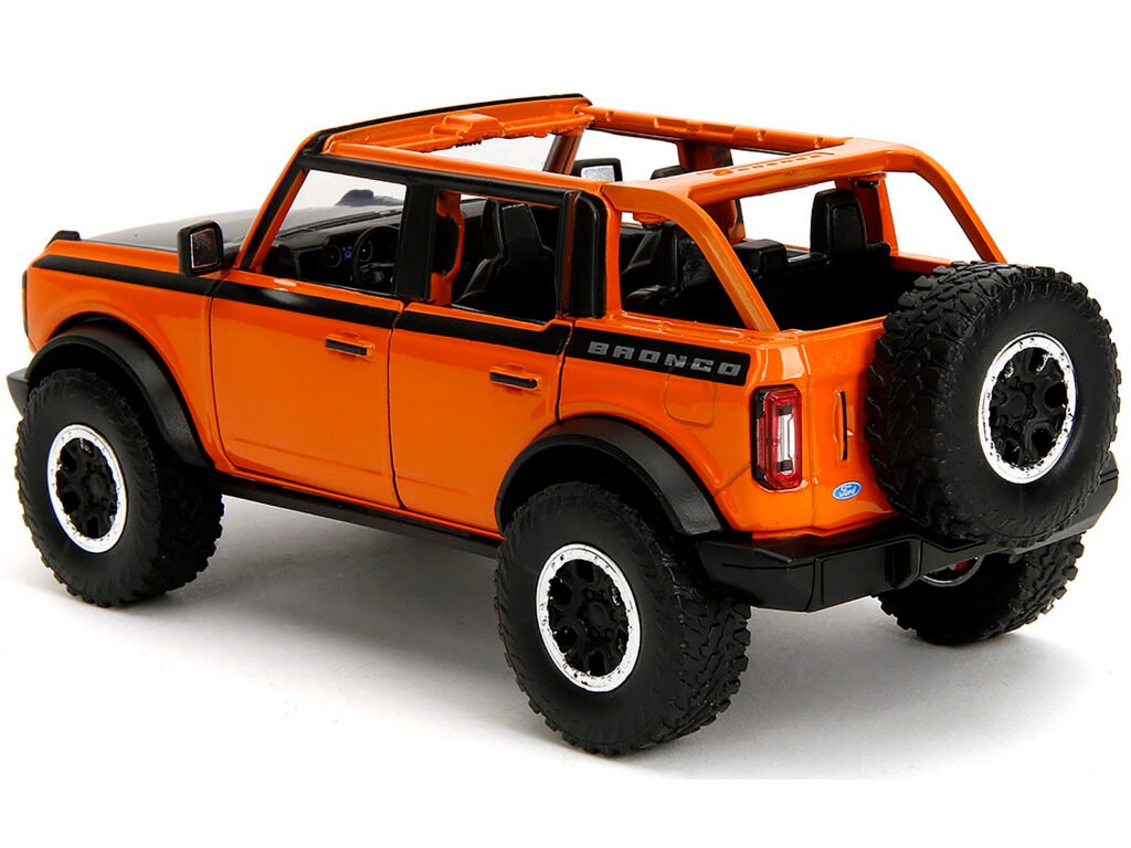 2021 Ford Bronco Open-Top Orange with Black Stripes and Hood with Extra Wheels “Just Trucks” Series 1/24 Diecast Model Car by Jada