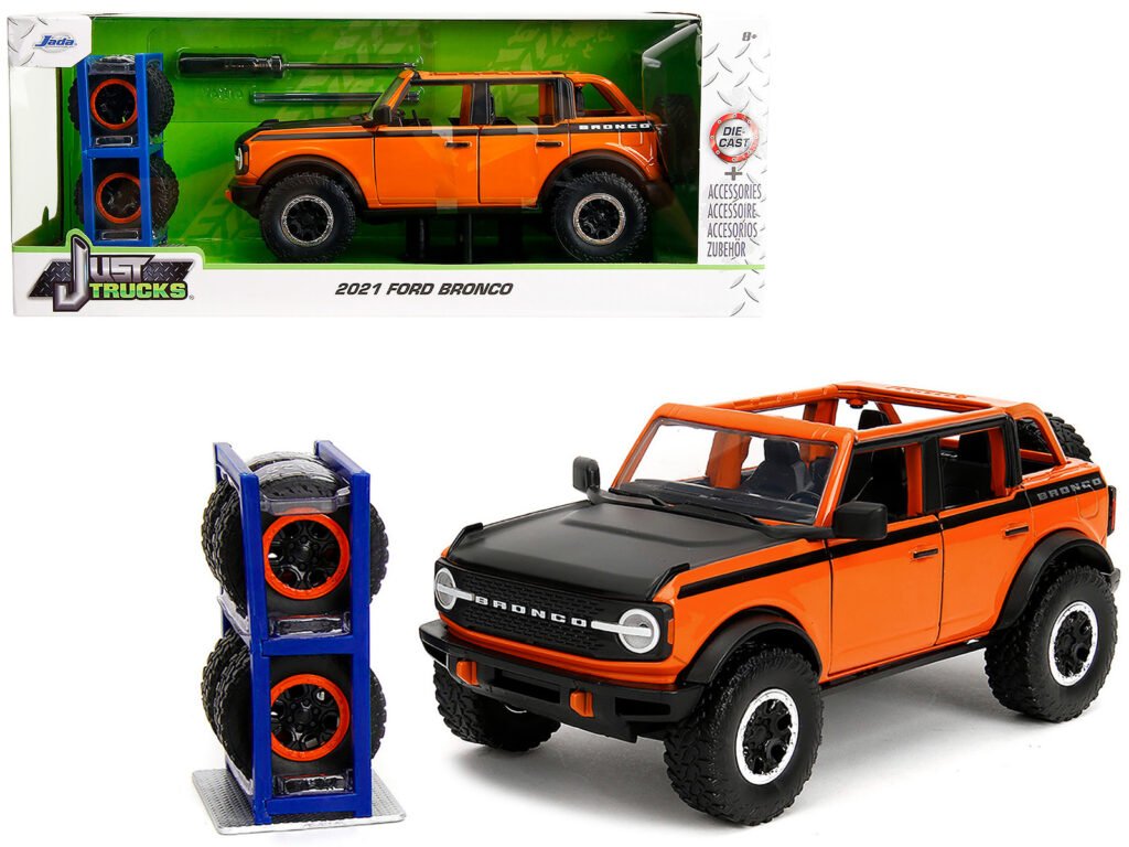 2021 Ford Bronco Open-Top Orange with Black Stripes and Hood with Extra Wheels “Just Trucks” Series 1/24 Diecast Model Car by Jada